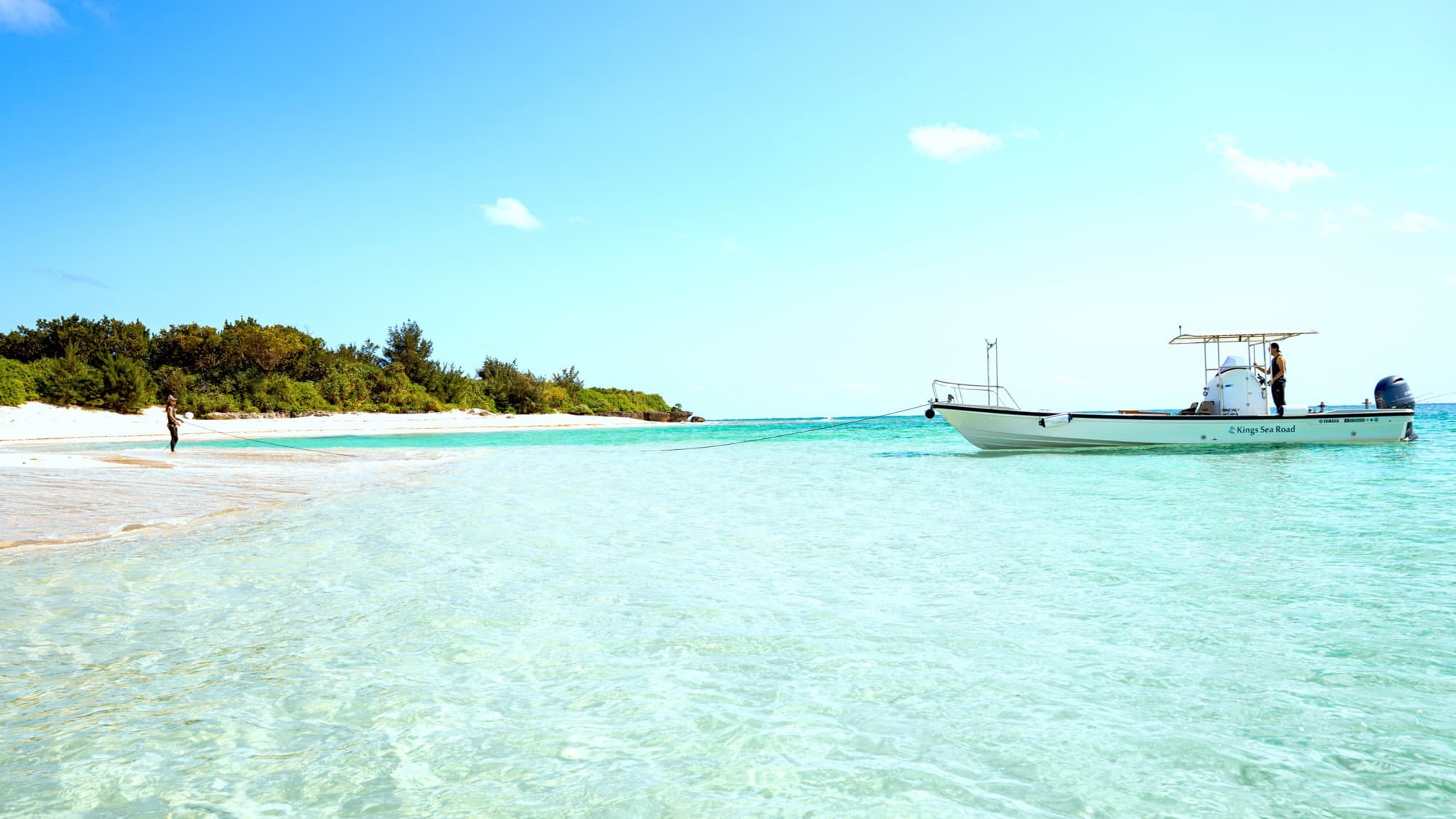 A private boat anchored at an uninhabited island on Okinawa's east coast — no crowds