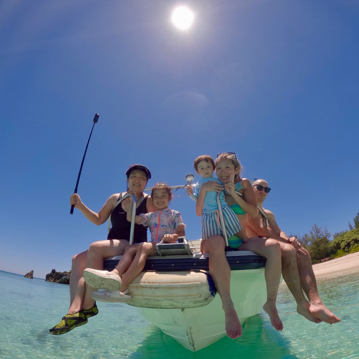 Family photo on the bow of our private boat