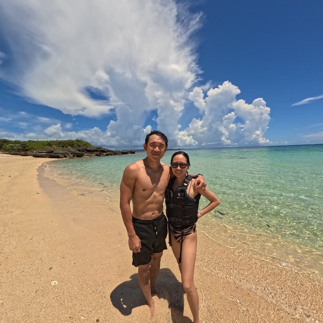 Guests in the clear shallows off Hamahiga Island